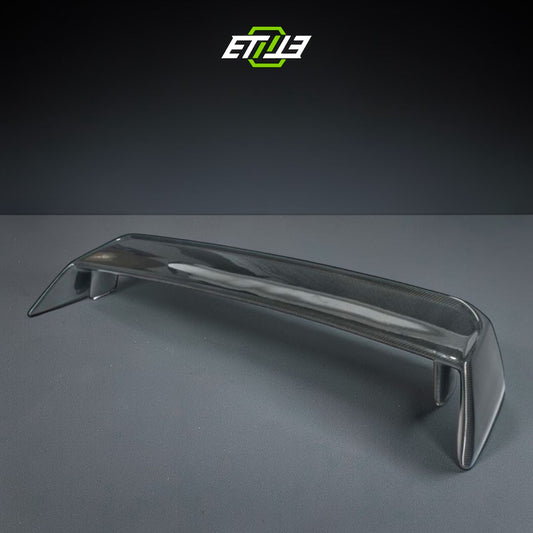 R32 OEM-style rear spoiler β bespoke carbon, front view, ETi