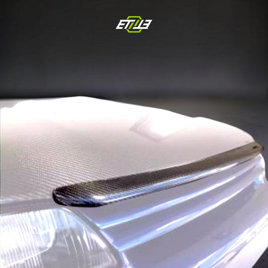 R32 NS hood lip — carbon fiber weave detail, ETi