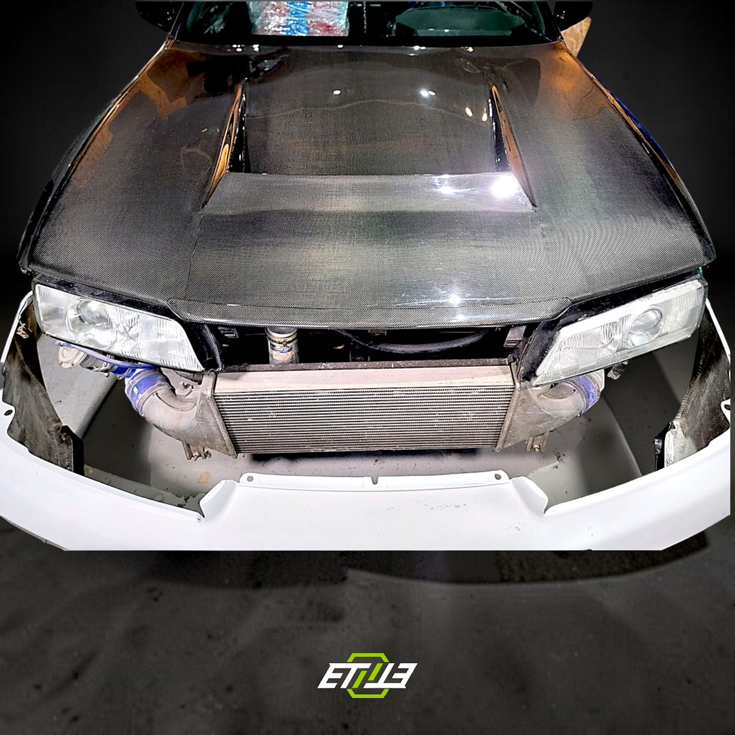 R32 NS hood lip — gloss carbon, fitted on car, ETi