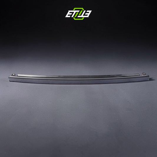 R32 NS trunk spoiler — gloss carbon fiber, front view, ETi