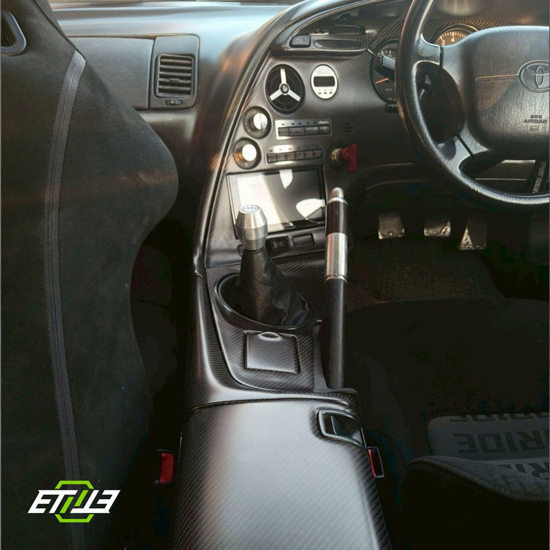 Carbon center console and dashboard trim installed in a right-hand-drive MK4 Toyota Supra