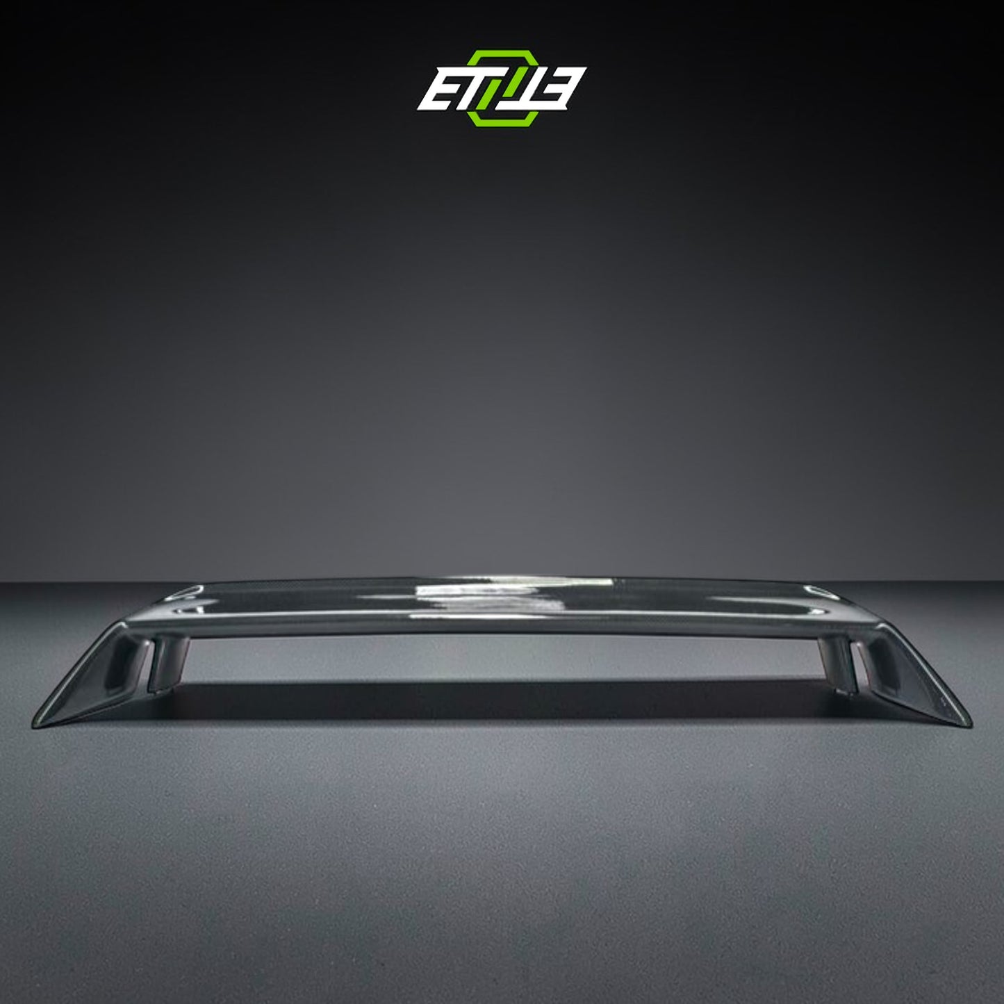 R32 OEM-style rear spoiler — bespoke carbon, rear three-quarter view, ETi