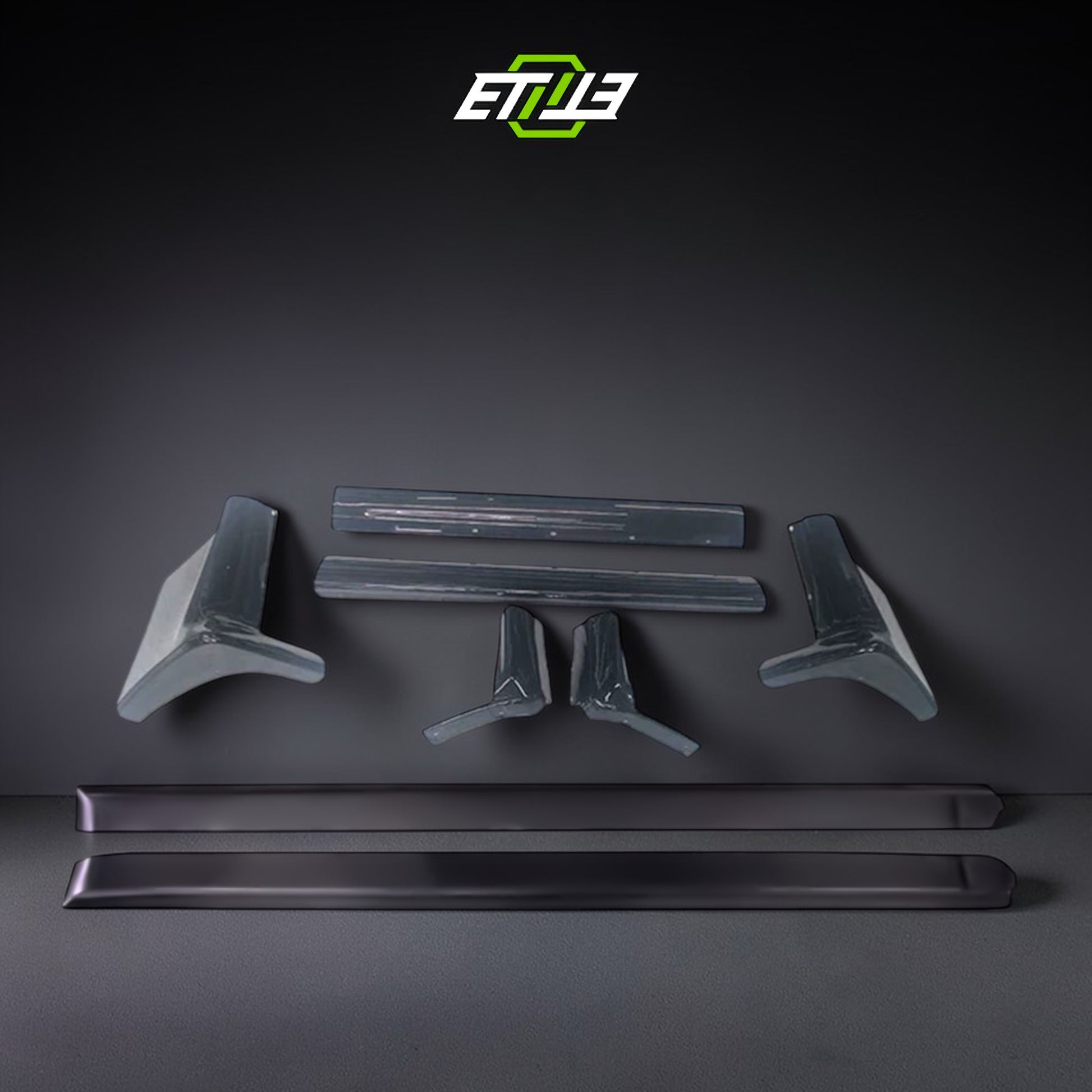 R32 N1 style side skirt add-on — gloss carbon fiber, front view, ETi