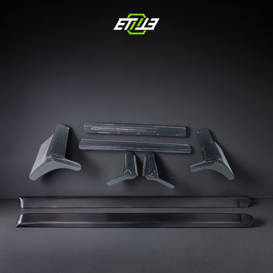 R32 N1 style side skirt add-on — gloss carbon fiber, front view, ETi
