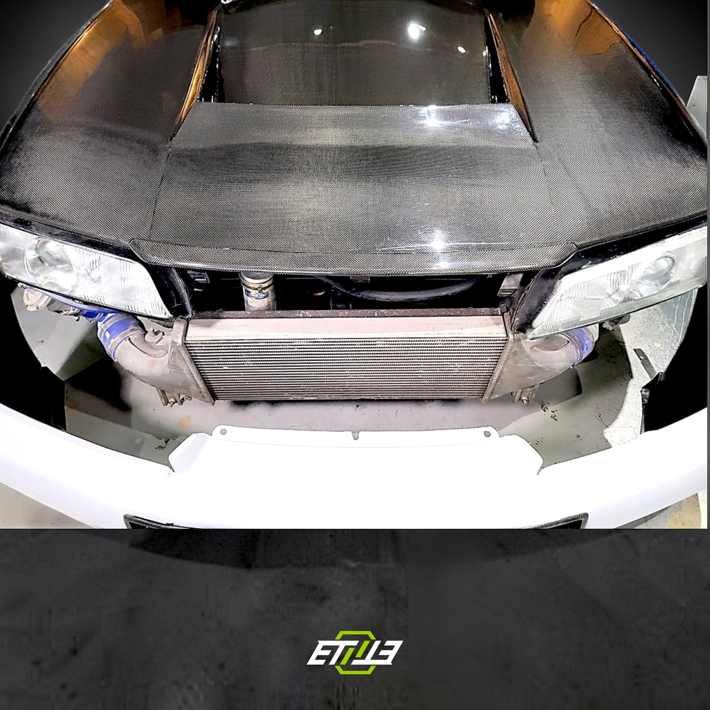 R32 NS hood lip — carbon fiber, side profile, ETi