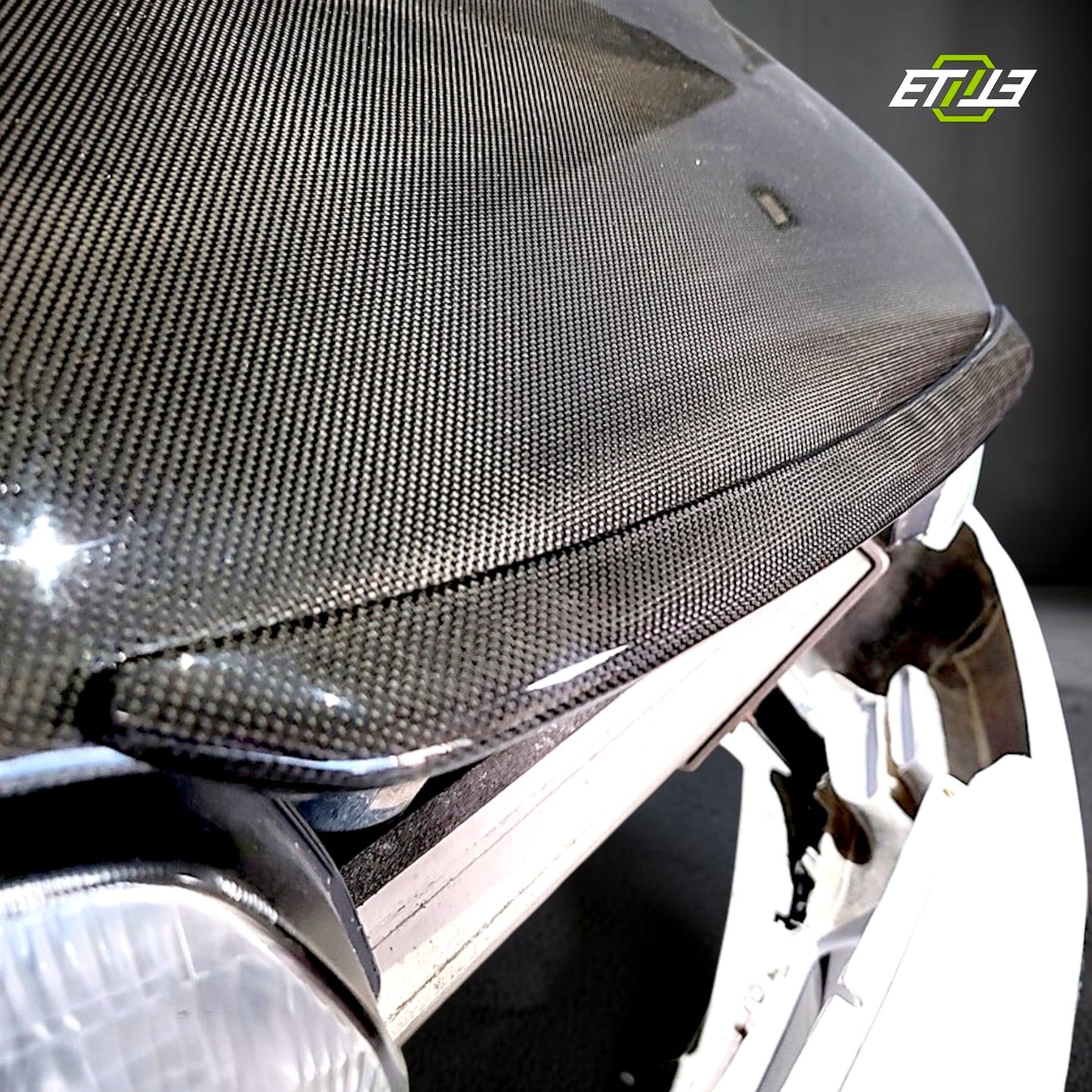 R32 NS hood lip — gloss carbon, edge detail, ETi