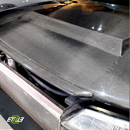 R32 NS hood lip — carbon fiber, underside view, ETi