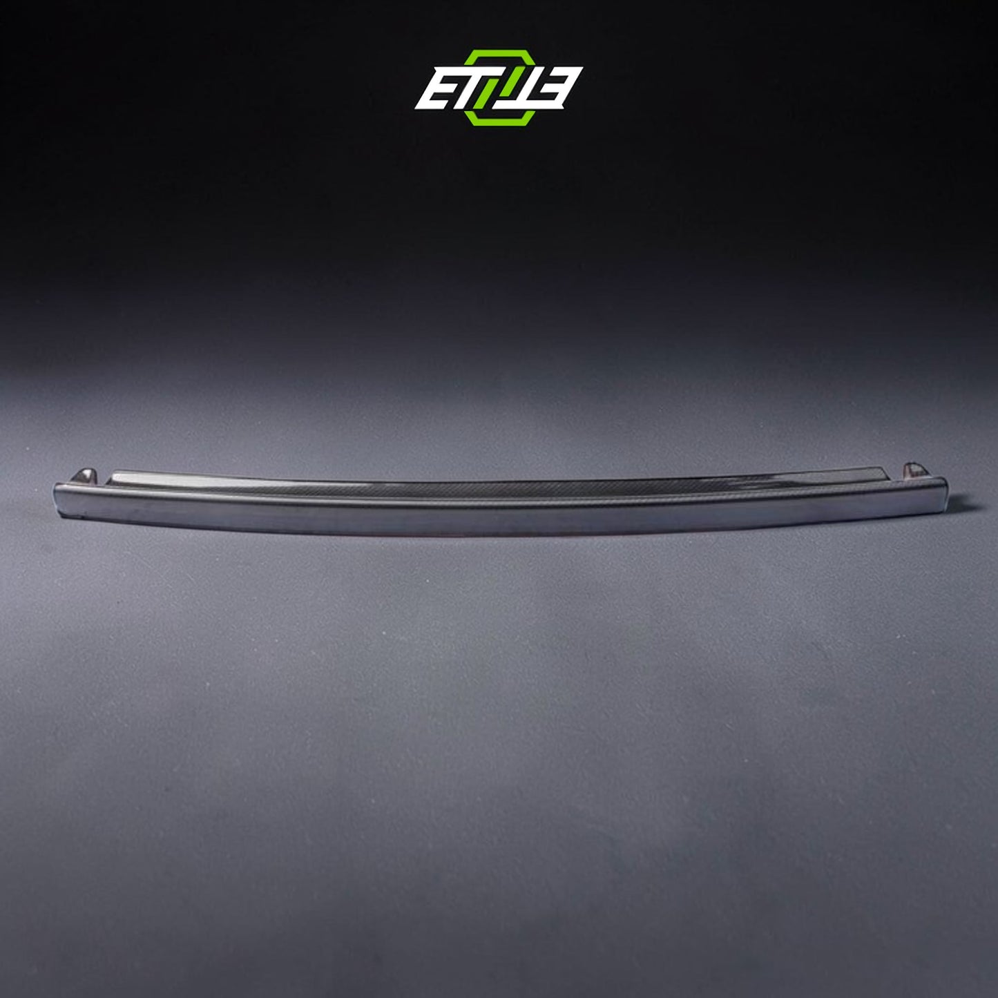 R32 NS trunk spoiler — gloss carbon fiber, front view, ETi