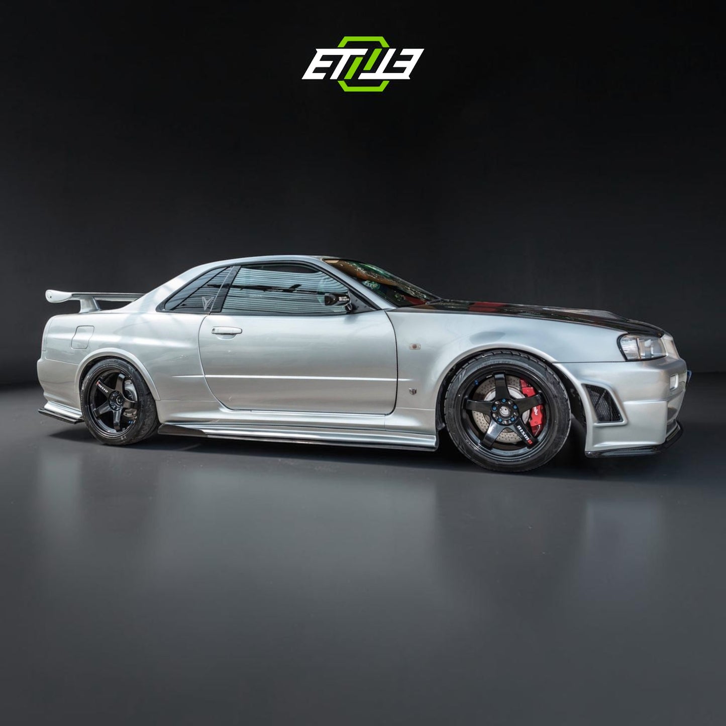 R34 Z-Tune style carbon vented hood — dry carbon weave detail, ETi