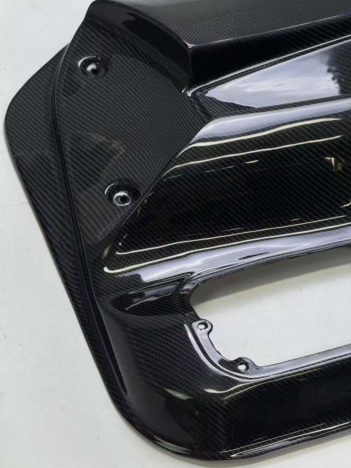 Nissan Skyline R32 carbon fiber door card - mounting point and weave detail
