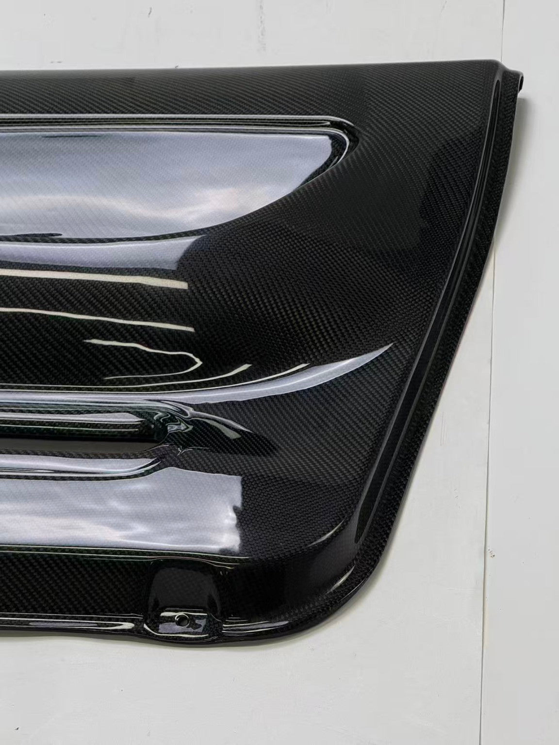 Nissan Skyline R32 carbon fiber door card - edge profile and surface finish detail