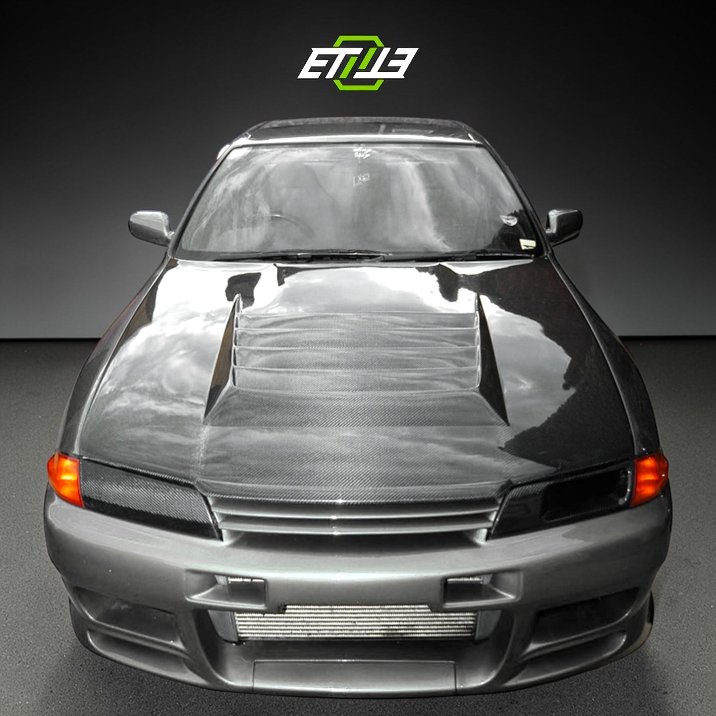 R32 Nismo style vented hood — carbon fiber, front view, ETi