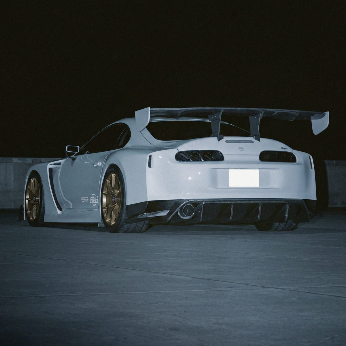 White Toyota Supra A80 with the ETi MK4 Supra Widebody kit and GT wing, rear three-quarter view at night, render