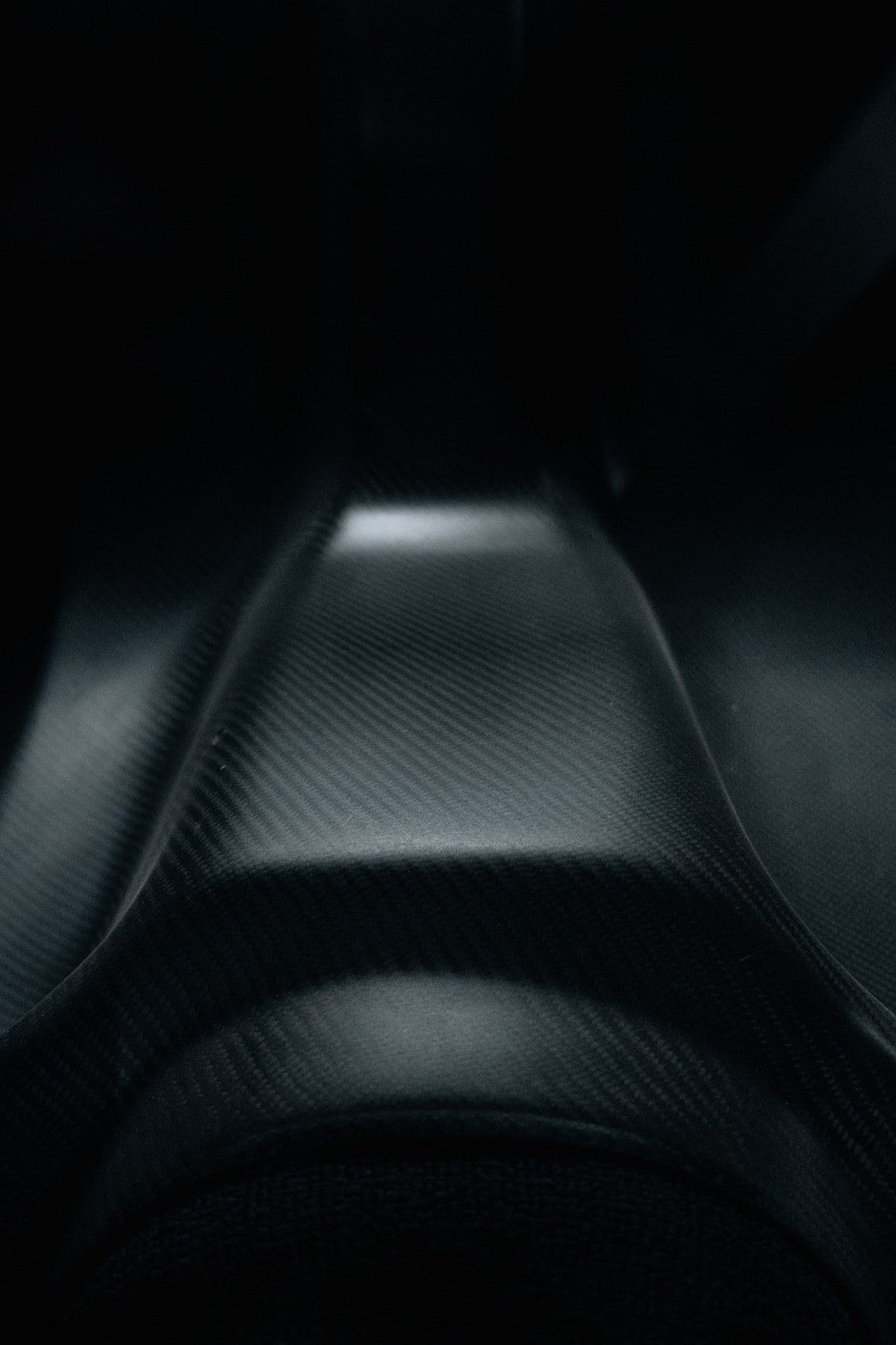 Detail view of Mazda RX-7 FD3S carbon rear seat delete surface and contours