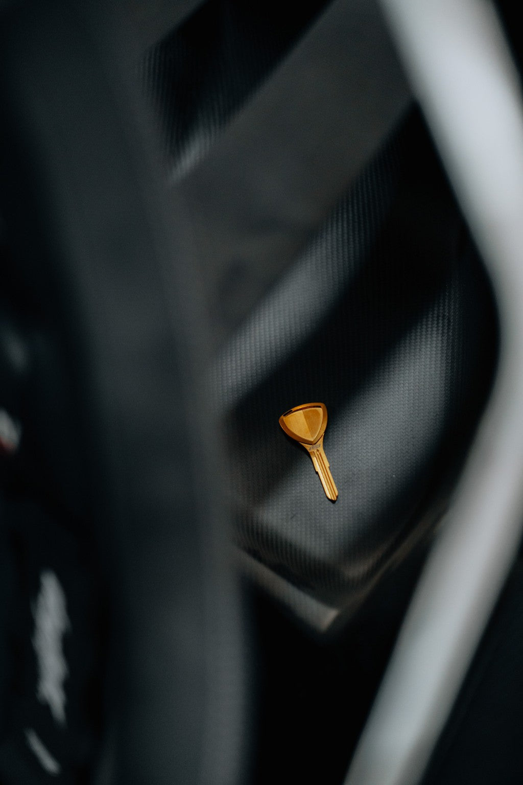 Mazda RX-7 FD3S carbon rear seat delete with titanium key detail